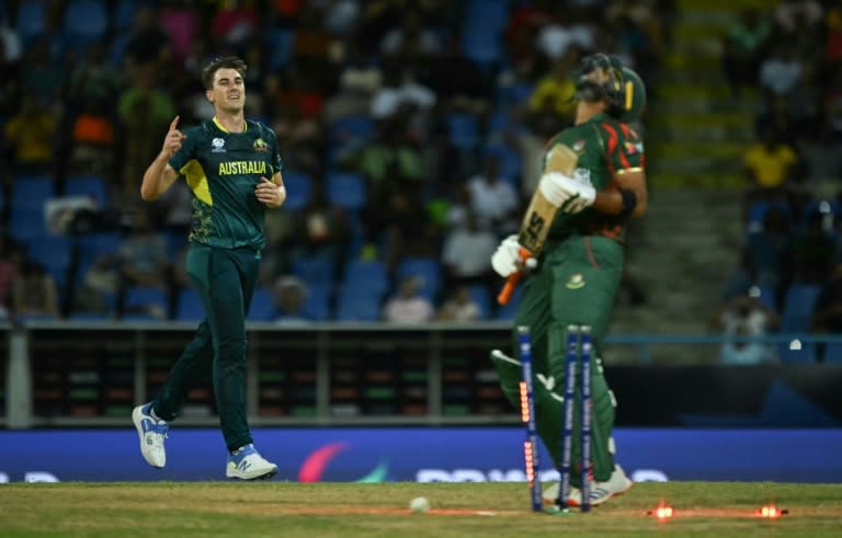 Australia's Pat Cummins celebrates the first wicket of his hat-trick against Bangladesh in the T20 World Cup (ANDREW CABALLERO-REYNOLDS)