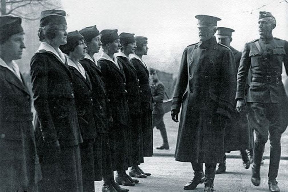 Gen. John Pershing stands in front of one of the Hello Girls units. It was believed Pershing did not interact with the Hello Girls, but this photo, from the National Archives, disproves that.