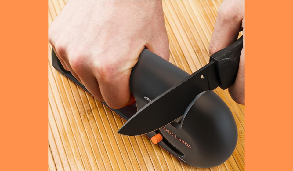hands using the knife sharpener