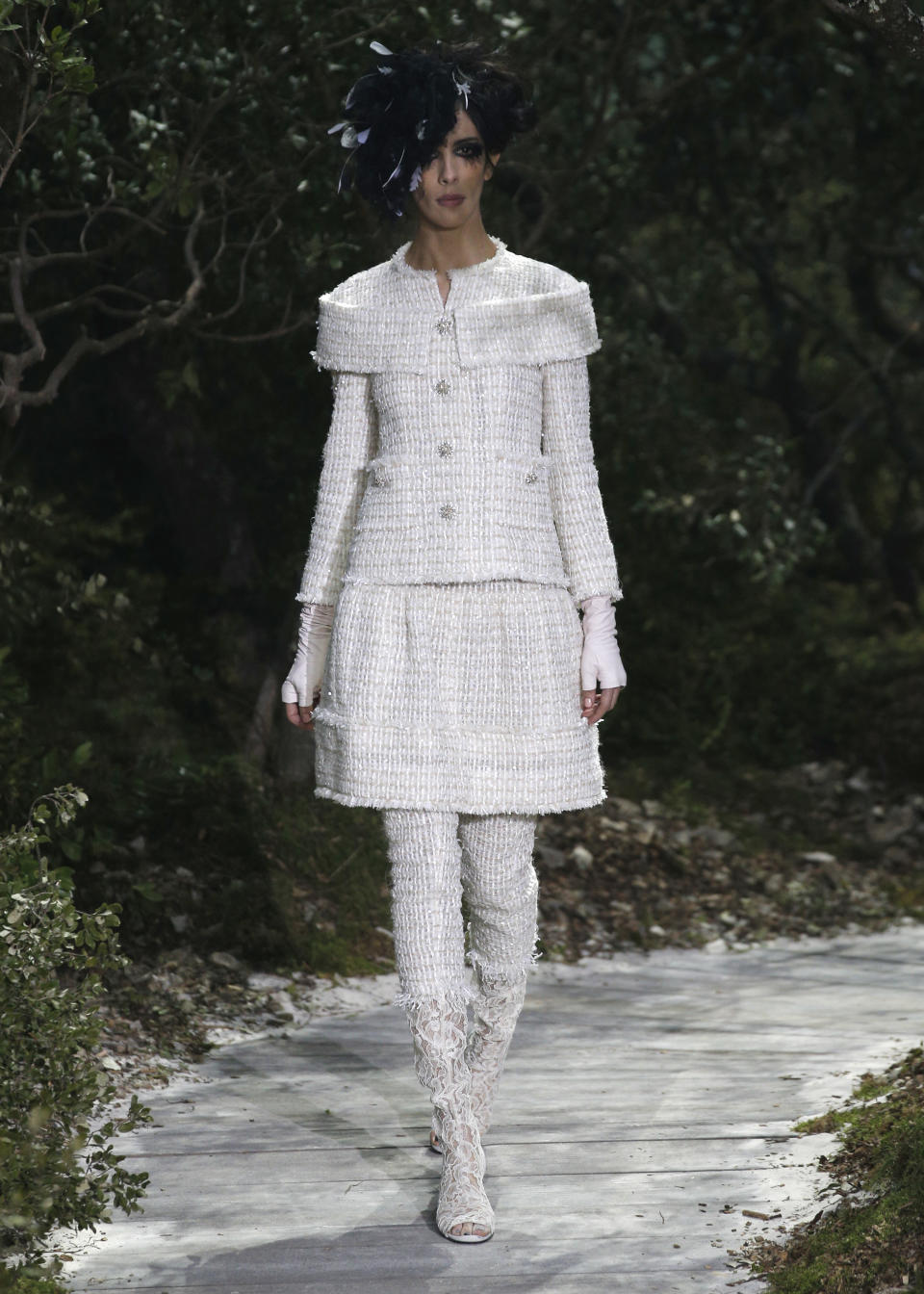 A model presents a creation by German fashion designer Karl Lagerfeld for Chanel's Spring-Summer 2013 Haute Couture fashion collection, presented in Paris, Tuesday, Jan.22, 2013. (AP Photo/Christophe Ena)