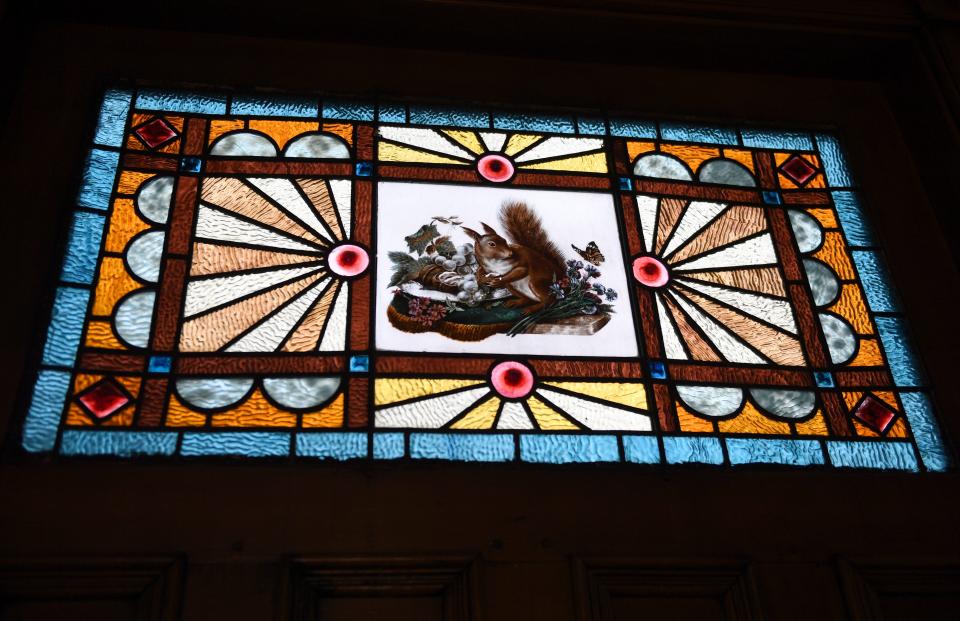 A stained glass window with an American red squirrel design inside the dining room at the Gillis-Grier Bed and Breakfast Feb. 23, 2024, in Salisbury, Maryland.