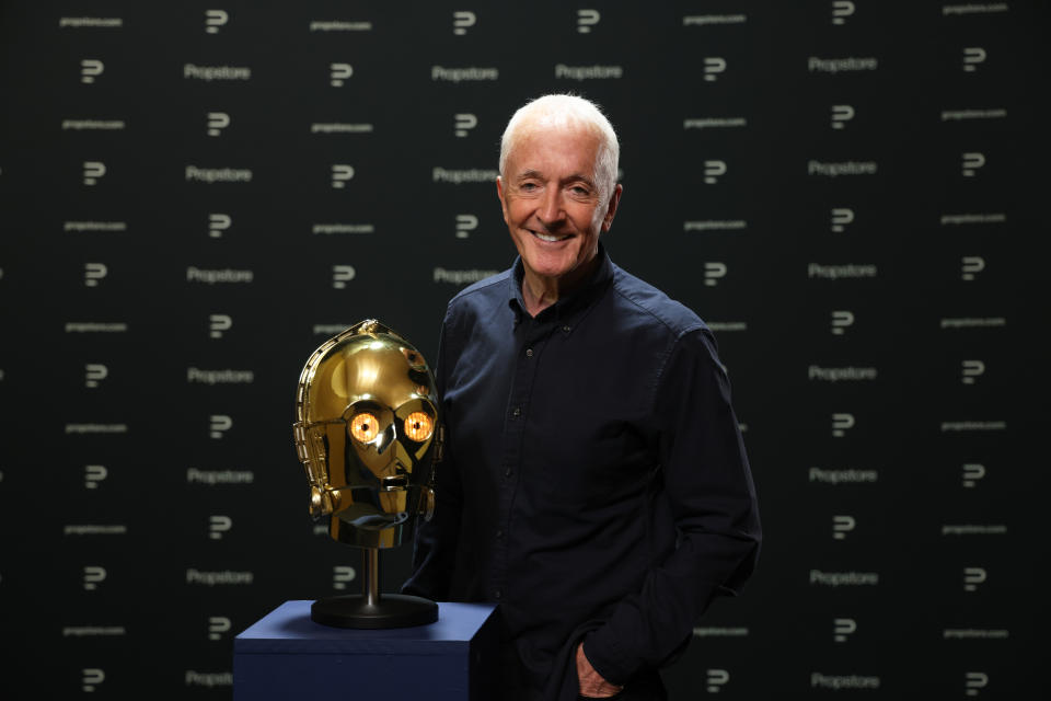 Anthony Daniels with the screen matched light-up C-3PO head from his personal collection that is being sold by the Propstore (Propstore)