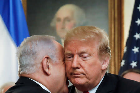 FILE PHOTO: Israel's Prime Minister Benjamin Netanyahu talks with U.S. President Donald Trump during their meetings at the White House in Washington, U.S., March 25, 2019. REUTERS/Carlos Barria/File Photo