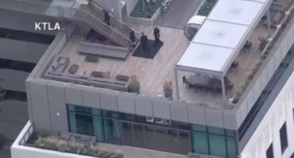 Police officers were seen on the rooftops of the buildings in the studio. Source: KTLA