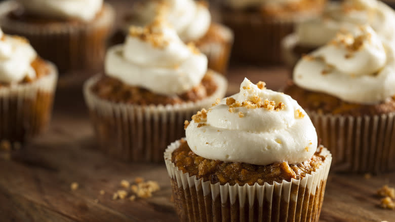 Carrot muffins with frosting and nuts