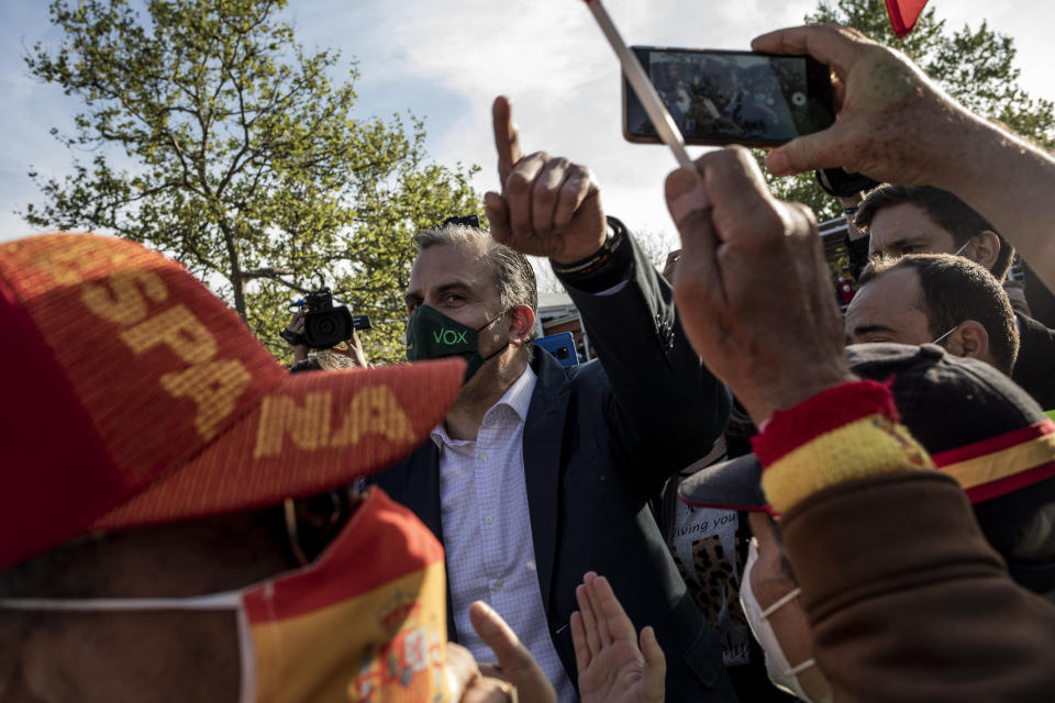 Far-right Vox party deputy Javier Ortega Smith attends an election campaign rally in Madrid, Spain, Wednesday, April 7, 2021. Residents in Madrid, one of Europe's worst-hit regions by the coronavirus pandemic, are hitting the polls on Tuesday to elect a new regional assembly in a vote resembling a plebiscite on lockdown measures. (AP Photo/Bernat Armangue)