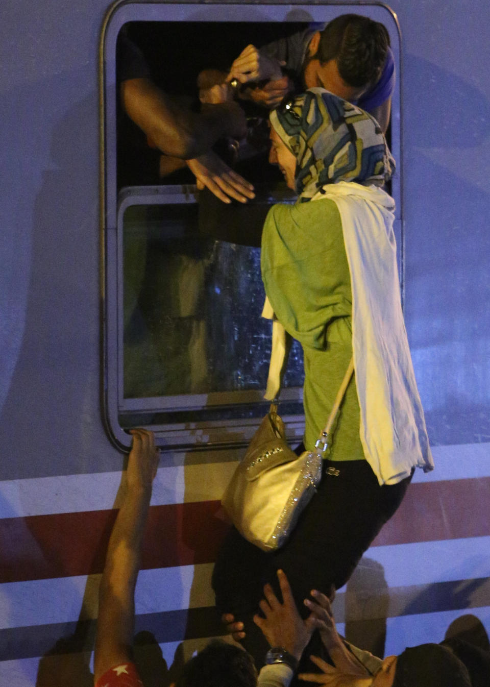 A stampede occurs as Middle Eastern refugees rush to find space on a train headed to Beli Manastir on September 18, 2015 in Tovarnik, Croatia.&nbsp;