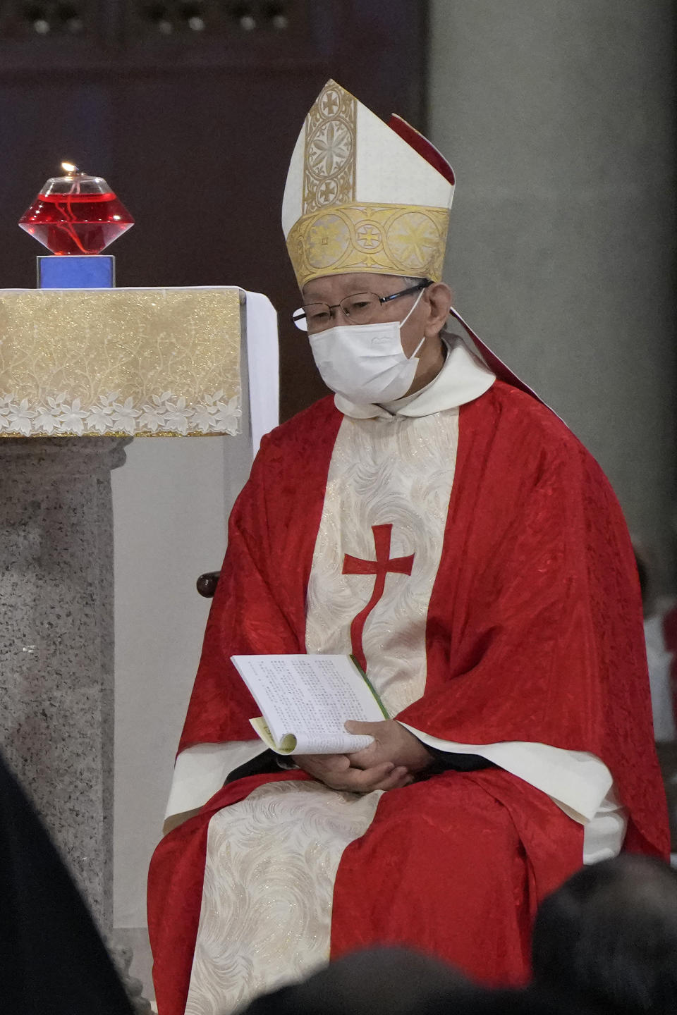 Retired archbishop of Hong Kong Joseph Zen, center, attends the episcopal ordination ceremony of Bishop Stephen Chow, in Hong Kong, Saturday, Dec. 4, 2021. Zen, the 90-year-old Catholic cleric arrested by Hong Kong police on national security charges, has long been a fiery critic of Beijing, along with efforts by the Vatican to reach a working arrangement with the ruling Communist Party. (AP Photo/Kin Cheung)