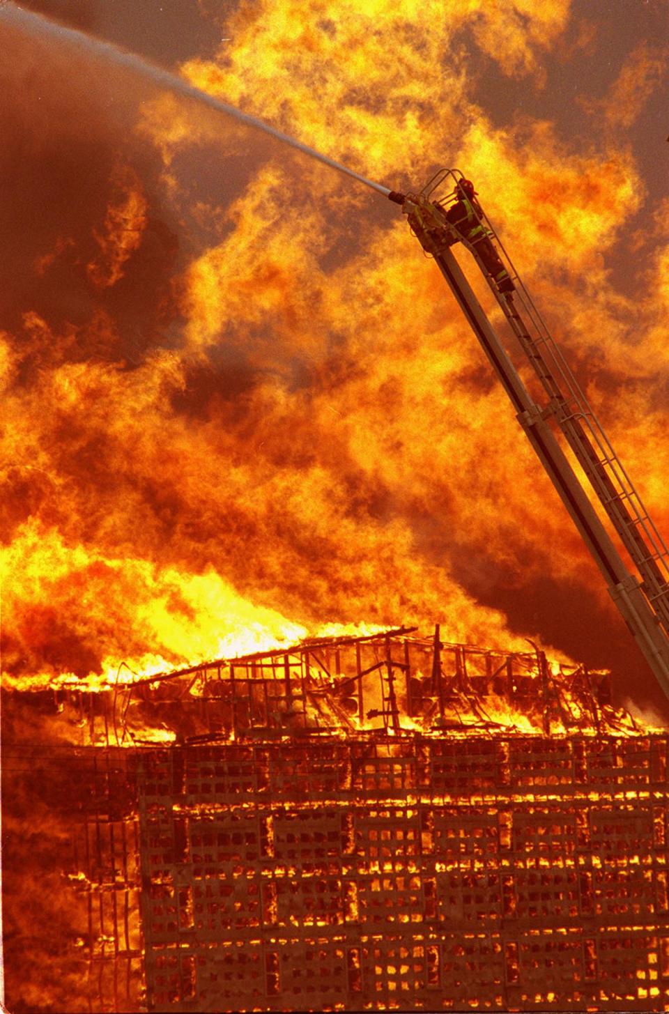 -

-   Between 125 and 150 firefighters fought the blaze just south of Bardstown. Officials decided to let it burn itself out, with firefighters remaining to make sure it didn't spread.-

-A firefighter sprays water in an attempt to control the fire at Heaven Hill Distillery in Bardstown, Ky., on Thursday, Nov. 7, 1996. Fire destroyed more than six bourbon whiskey warehouses. Each warehouse contained at least 20,000 barrels of bourbon. Firefighters from more than ten fire departments responded. Firefighters reported that burning whiskey ran downhill from the site and set a stream on fire.(AP Photo/News-Enterprise, Jayme Burden)