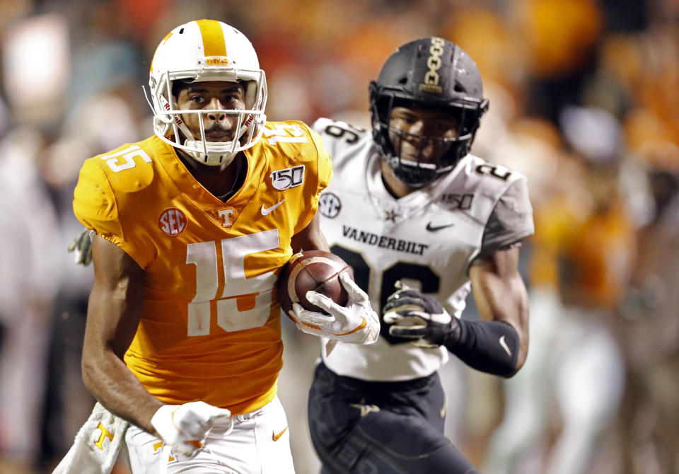 Tennessee wide receiver Jauan Jennings (15) outruns Vanderbilt safety Anfernee Orji (26) in the second half of an NCAA college football game Saturday, Nov. 30, 2019, in Knoxville, Tenn. (AP Photo/Wade Payne)