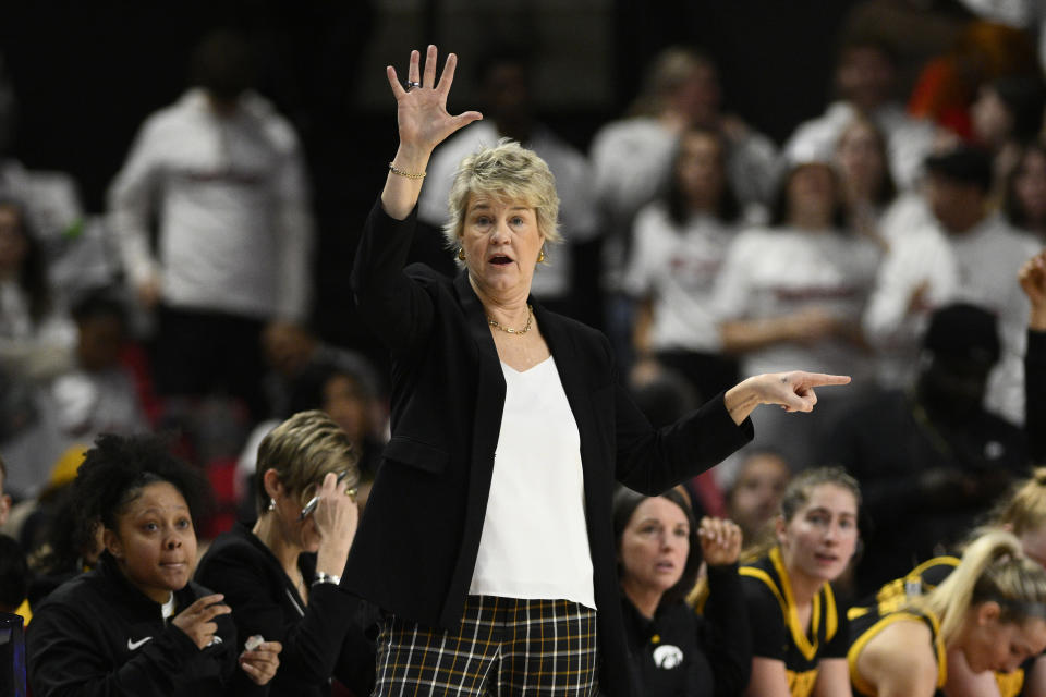 Iowa head coach Lisa Bluder gestures during the second half of an NCAA college basketball game against Maryland, Saturday, Feb. 3, 2024, in College Park, Md. (AP Photo/Nick Wass)