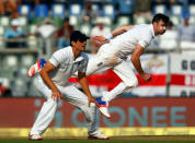 Cricket - India v England - Fourth Test cricket match - Wankhede Stadium, Mumbai, India - 9/12/16. England's James Anderson (R) bowls as Alastair Cook looks on. REUTERS/Danish Siddiqui