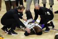 Brooklyn Nets forward Jeff Green is attended to after being injured in a collision with Los Angeles Clippers guard Patrick Beverley during the second half of an NBA basketball game Sunday, Feb. 21, 2021, in Los Angeles. (AP Photo/Mark J. Terrill)
