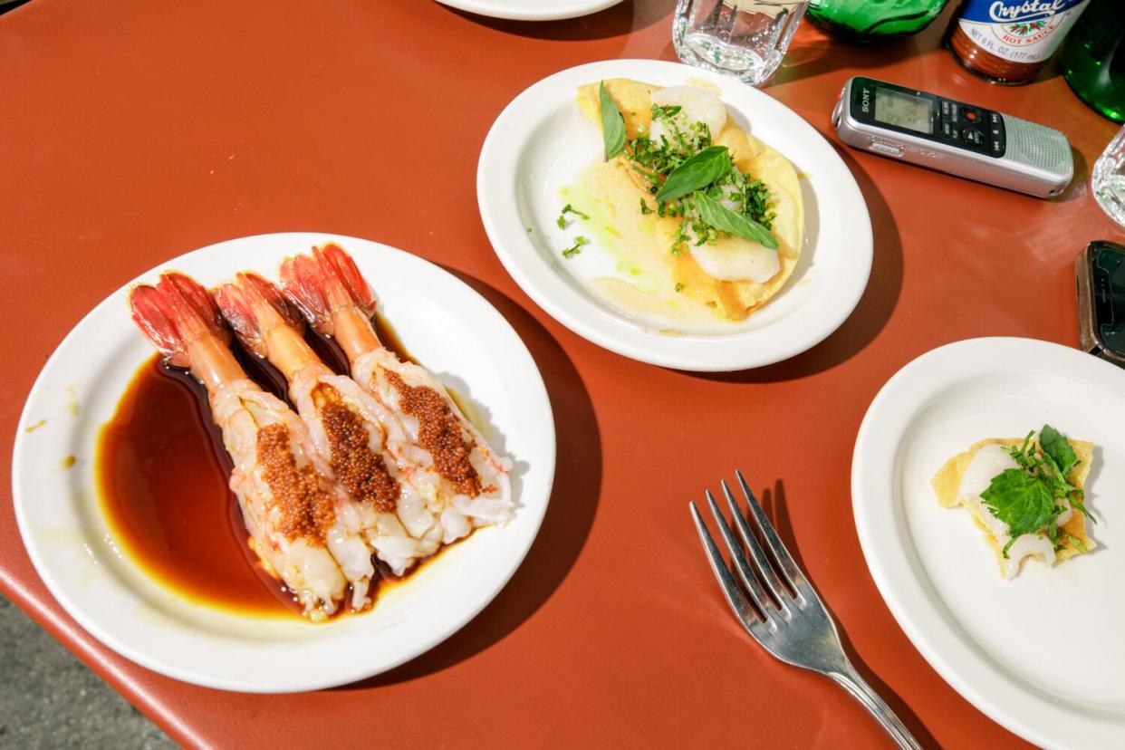 Glistening shrimp on a plate outside Found Oyster.