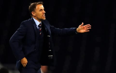 Phil Neville gestures on the touchline - Credit: Getty images