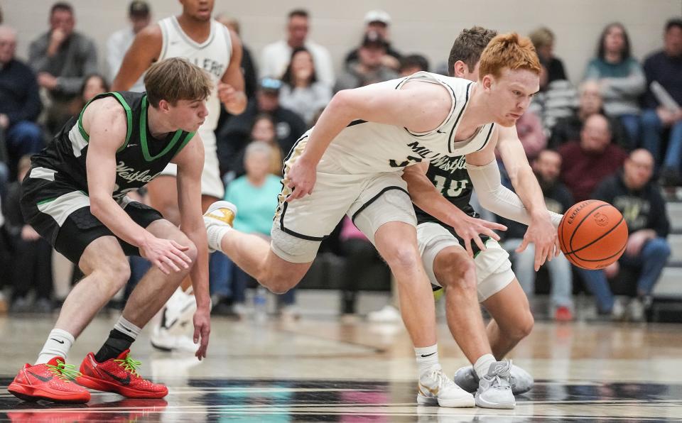 Noblesville Millers guard Aaron Fine (3) rushes after the ball Wednesday, Jan. 17, 2024, during the game at Noblesville High School in Noblesville. The Westfield Shamrocks defeated the Noblesville Millers, 58-54.