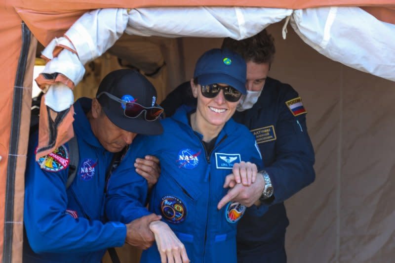 NASA astronaut Loral O'Hara (C) is shown after the landing of a Soyuz MS-24 spacecraft Saturday in Kazakhstan. She and fellow Expedition 70 members Oleg Novitskiy of Russia and Belarus spaceflight participant Marina Vasilevskaya landed in a remote area near the town of Zhezkazgan following a stay on the International Space Station. Photo provided by Roscosmos/EPA-EFE