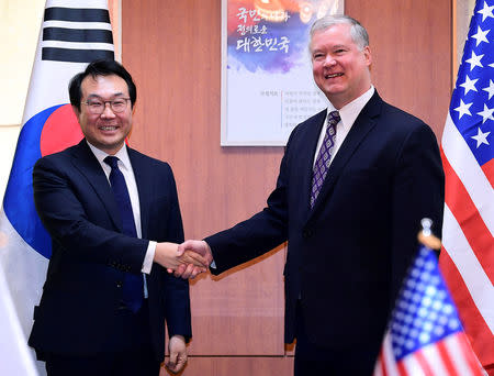 FILE PHOTO: US special representative for North Korea Stephen Biegun (R), shakes hands with South Korea's Special Representative for Korean Peninsula Peace and Security Affairs Lee Do-hoon (L) prior to their meeting at the Foreign Ministry in Seoul, South Korea 09 February 2019. KIM MIN-HEE/Pool via REUTERS/File Photo