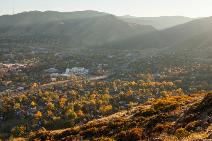 <span class="article__caption">View of Golden, Colorado from Golden Cliffs on North Table Mountain</span> (Photo: Cavan Images/Getty)