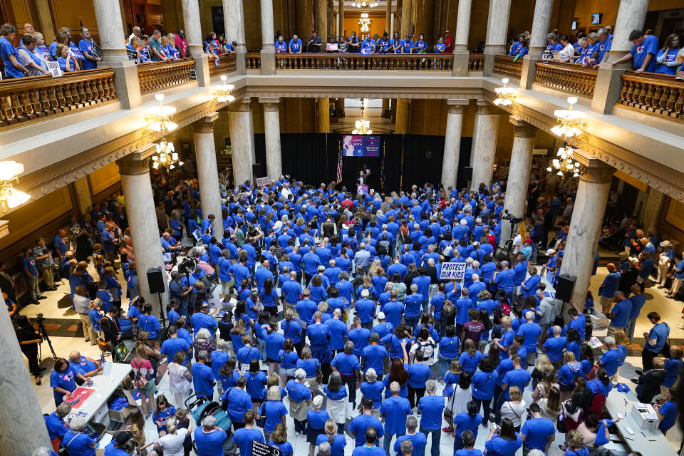 FILE - Anti-abortion supporters rally as the Indiana Senate Rules Committee met to consider a Republican proposal to ban nearly all abortions in the state during a hearing at the Statehouse in Indianapolis, July 26, 2022. The debate over a limited set of circumstances in which abortion could be legal is causing divisions among GOP lawmakers in some states. (AP Photo/Michael Conroy, File)