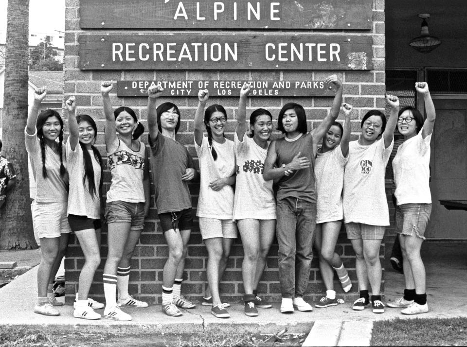 The Sisters basketball team at the Alpine Recreation Center in Chinatown&nbsp;raise their fists in solidarity.&nbsp;