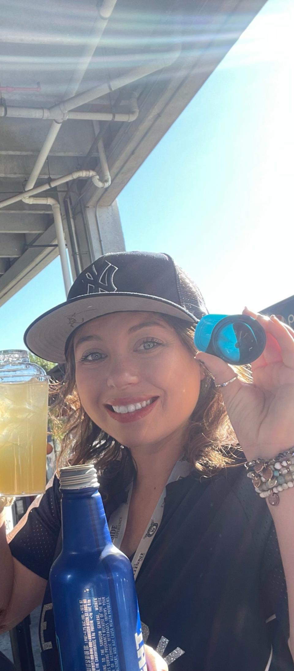 A woman with a Yankees hat on.