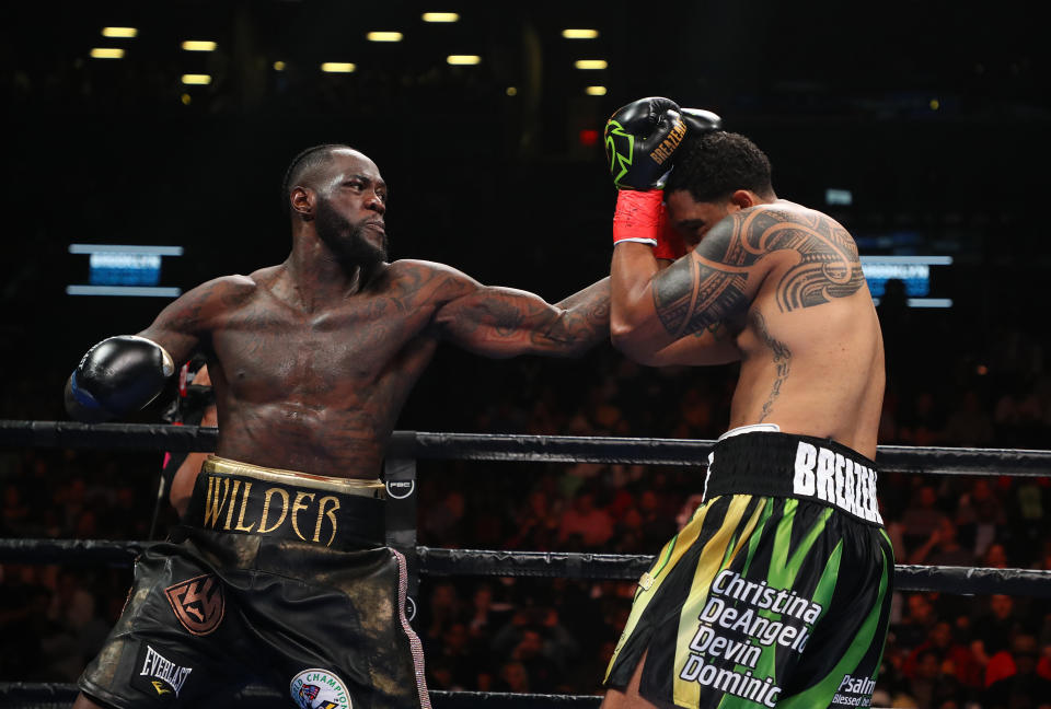 NEW YORK, NEW YORK - MAY 18:  Deontay Wilder punches Dominic Breazeale during their bout for Wilder's WBC heavyweight title at Barclays Center on May 18, 2019 in New York City. (Photo by Al Bello/Getty Images)