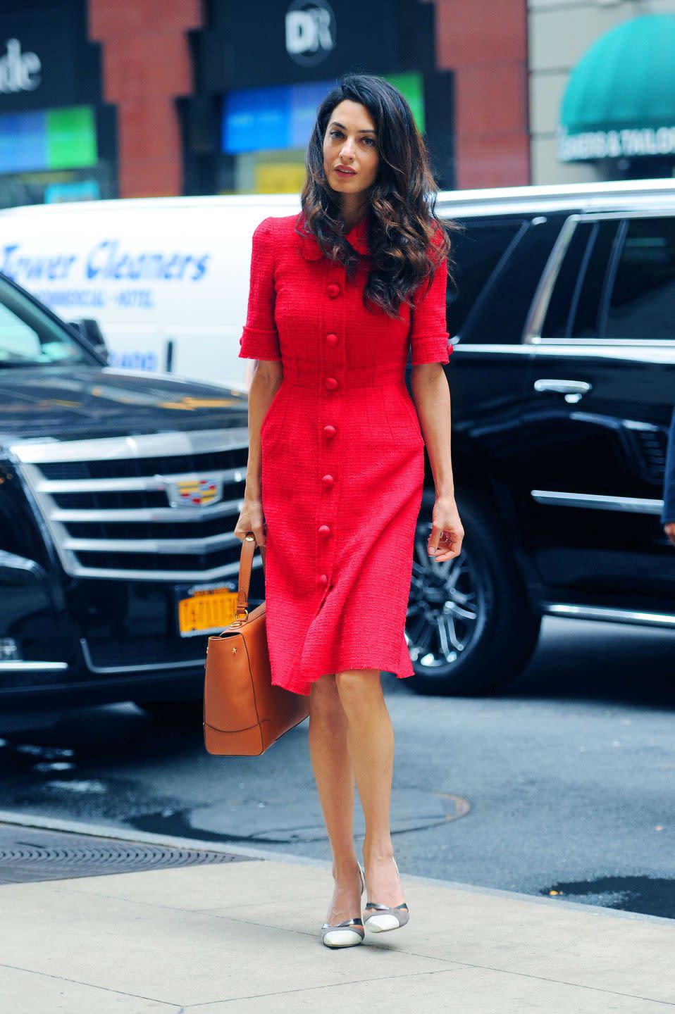 <p>For an afternoon in New York City, Amal looked gorgeous in a Dolce & Gabbana dress. Those buttons!</p>