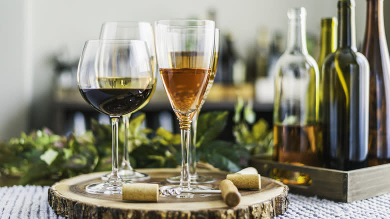 glasses and bottles of various wines