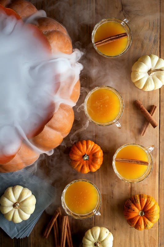 <p>Honestly Yum</p><p>What better way to entertain your guests than with a spooky pumpkin punch? Served, naturally, out of a creepy giant steaming pumpkin.</p><p><strong>Get the recipe: <a href="https://honestlyyum.com/6804/halloween-pumpkin-punch/" rel="nofollow noopener" target="_blank" data-ylk="slk:Halloween Pumpkin Punch;elm:context_link;itc:0;sec:content-canvas" class="link rapid-noclick-resp"><em>Halloween Pumpkin Punch</em></a></strong></p>