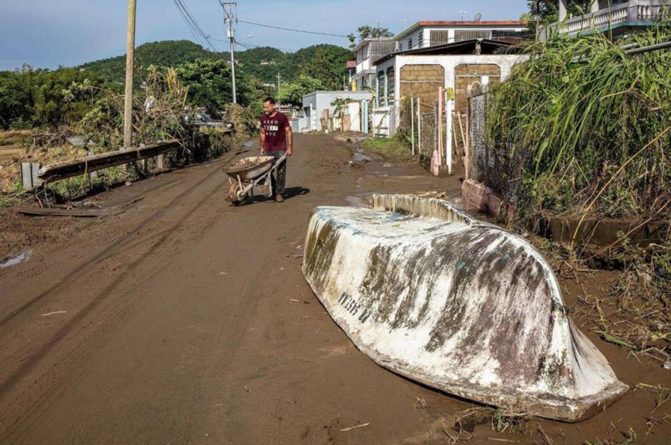 <div class="inline-image__caption"><p>Samuel Santiago removes mud from the front of his house in the San Jose de Toa Baja neighborhood.</p></div> <div class="inline-image__credit">Pedro Portal/Miami Herald via Getty </div>