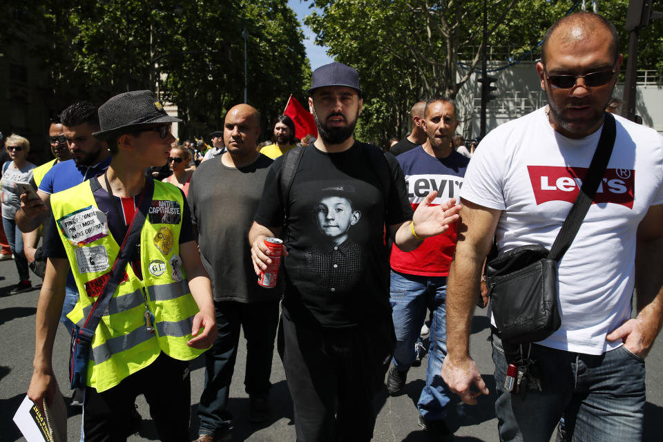 Eric Drouet, a prominent and divisive figure of the yellow vest movement, center, takes part to a march, in Paris, Saturday, June 1, 2019. Yellow vest protests are taking place for the 29th consecutive week to challenge President Emmanuel Macron's economic policies. (AP Photo/Francois Mori)