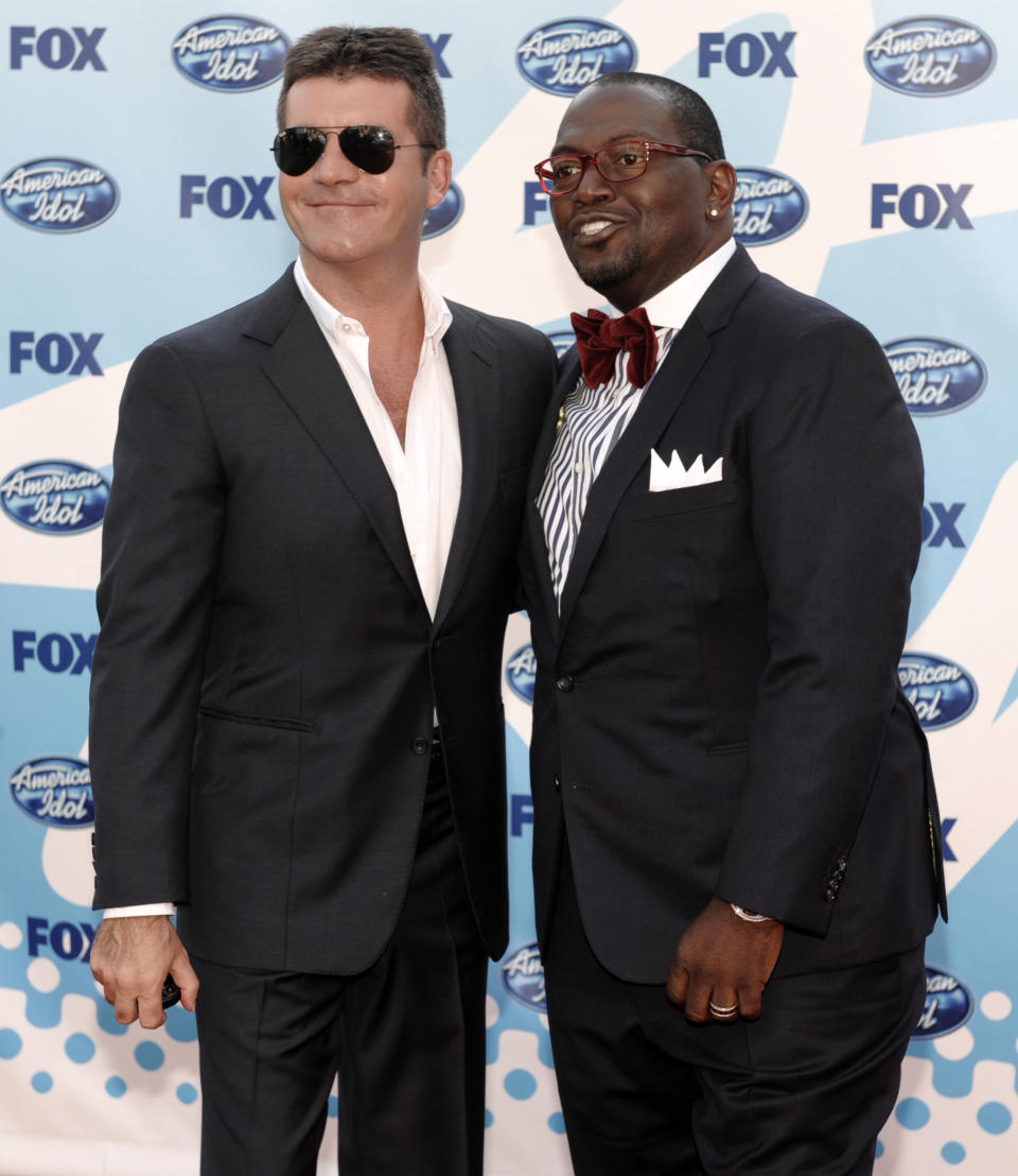 CAPTION CORRECTION: FILE - In this May 20, 2009 file photo, Judges Simon Cowell, left, and Randy Jackson arrive at the "American Idol" finale in Los Angeles. Jackson's announcement on Thursday, May 9, 2013, that he was departing the show means producers could plan a proper send-off for the lone remaining original judge soon, much the same way they did for Simon Cowell during the ninth season finale in 2010. (AP Photo/Chris Pizzello, File)