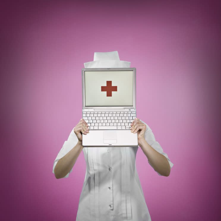 Stock image of nurse holding up laptop