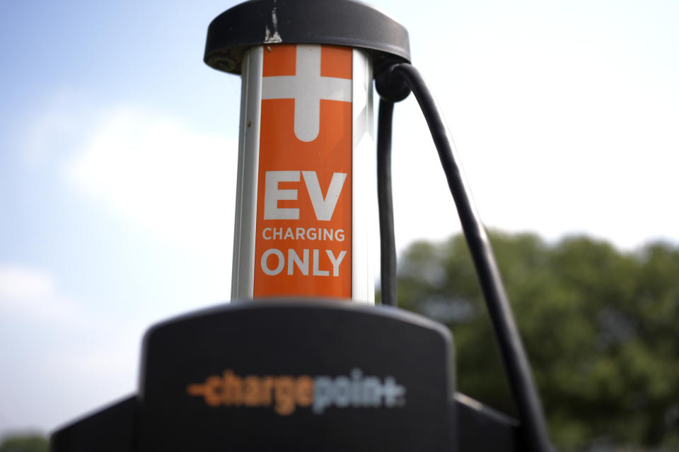 An EV charging station is seen Thursday, May 9, 2024, in San Antonio. Many Americans still aren’t sold on going electric for their next car purchase. High prices and a lack of easy-to-find charging stations are major sticking points. (AP Photo/Eric Gay)