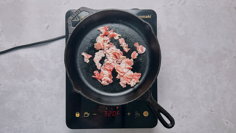 crumbled bacon in skillet