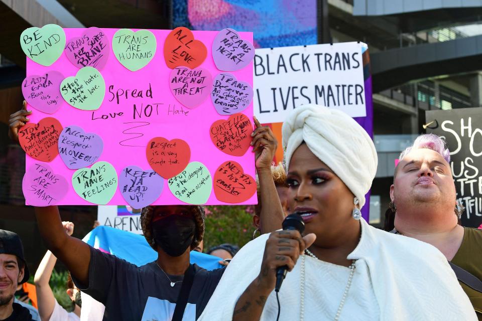 People rally in support of the Netflix transgender walkout in Los Angeles on October 20, 2021.