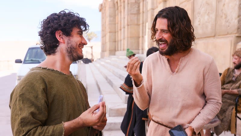 George Harrison Xanthis, who plays John, laughs with Jonathan Roumie, who plays Jesus, during a pause in filming of a faith-based streaming series on the life of Christ called "The Chosen" at The Church of Jesus Christ of Latter-day Saints' Jerusalem set in Goshen, Utah County, on Monday, Oct. 19, 2020.