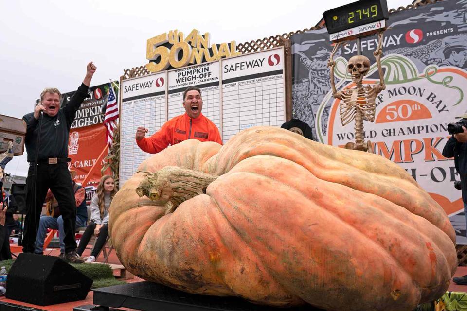 <p>Liu Guanguan/China News Service/VCG via Getty</p> Winner Travis Gienger from Anoka, Minnesota, posed with his giant pumpkin at the 50th annual World Championship Pumpkin Weigh-Off on October 9, 2023 in Half Moon Bay, California