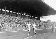 FILE - Vilho Ritola, of Finland, leads the field during the men's 10,000-meter race at the 1924 Olympics in Paris, In this 1924 file photo. Ritola won the gold medal for the event. Ahead of this summer's Paris Olympics, an exhibit in the French capital shows how the Games have been a "mirror of society" since the beginning of the 20th century. (AP Photo/File)