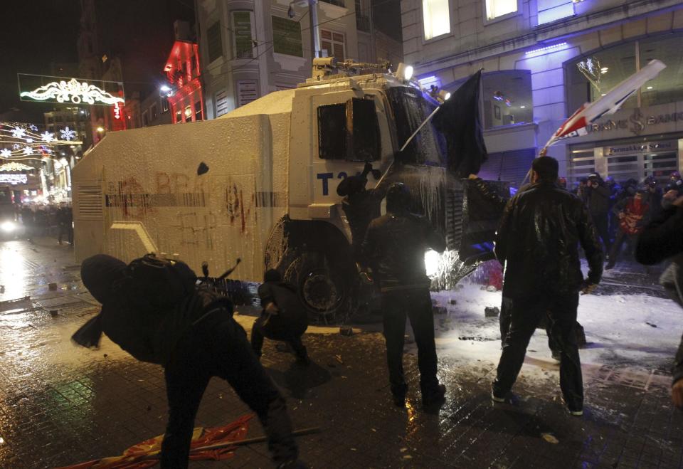 Demonstrators clash with riot police during a protest against internet censorship in Istanbul