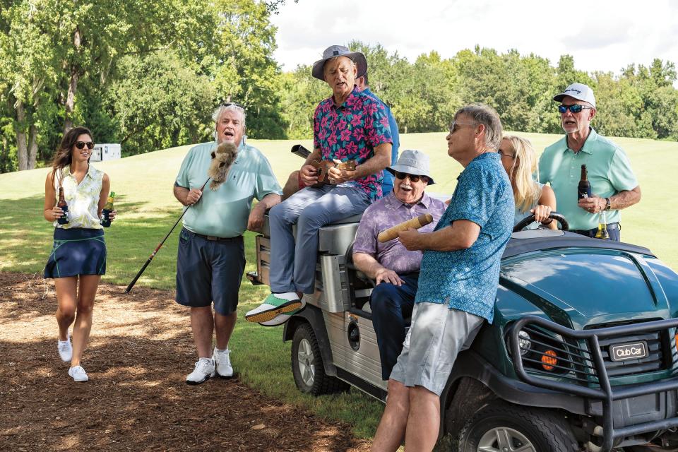 Andy Murray (left, singing into golf club) and his brothers will again play host to the Murray Bros. Caddyshack Charity Golf Tournament in April.