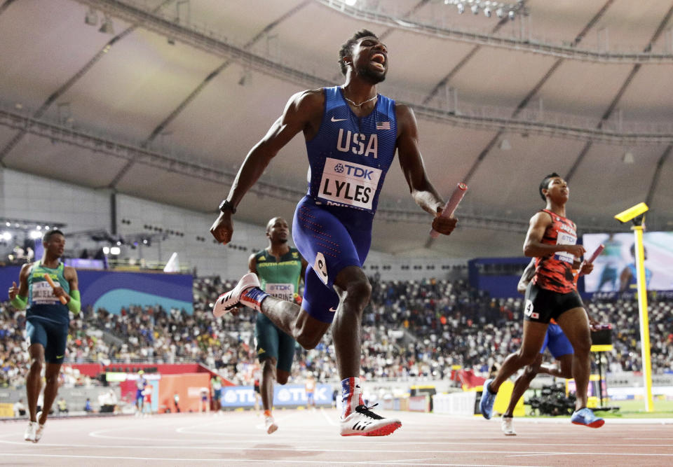 Noah Lyles of the United States leads the team to gold in the men's 4x100 meter relay final at the World Athletics Championships in Doha, Qatar, Saturday, Oct. 5, 2019. (AP Photo/Petr David Josek)