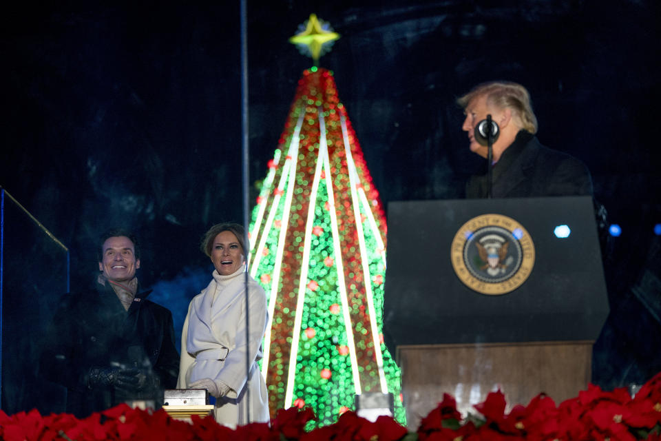 President Donald Trump, right, watches as host Antonio Sabato Jr., left, and first lady Melania Trump, second from left, light the National Christmas Tree during the National Christmas Tree lighting ceremony at the Ellipse near the White House in Washington, Wednesday, Nov. 28, 2018. (Photo: Andrew Harnik/AP)