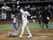 Miami Marlins Jazz Chisholm Jr. (2) celebrates after his home run during the eighth inning of a baseball game against the New York Mets, Friday, March 31, 2023, in Miami. (AP Photo/Michael Laughlin)