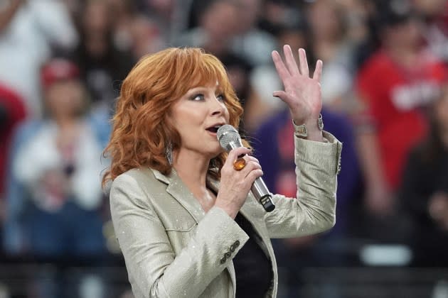 Reba McEntire sings the National Anthem ahead of Super Bowl LVIII between the Kansas City Chiefs and the San Francisco 49ers at Allegiant Stadium in Las Vegas, Nevada, February 11, 2024. - Credit: Timothy A. Clary/AFP/Getty Images