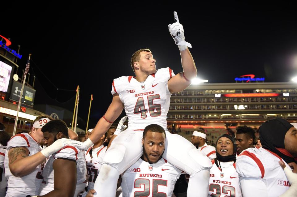 Rutgers linebacker Kevin Snyder (45), L.J. Liston (25) and others celebrate after they defeated Maryland 41-38 in an NCAA college football game, Saturday, Nov. 29, 2014, in College Park, Md. (AP Photo/Nick Wass)