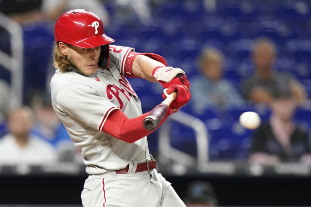 Philadelphia Phillies' Nick Maton is congratulated in the dugout after  hitting a two-run home run during the seventh inning of a baseball game  against the Miami Marlins, Tuesday, Sept. 13, 2022, in