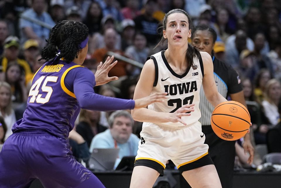 Iowa's Caitlin Clark looks to shoot past LSU's Alexis Morris during the second half of the NCAA Women's Final Four championship basketball game Sunday, April 2, 2023, in Dallas. (AP Photo/Tony Gutierrez)