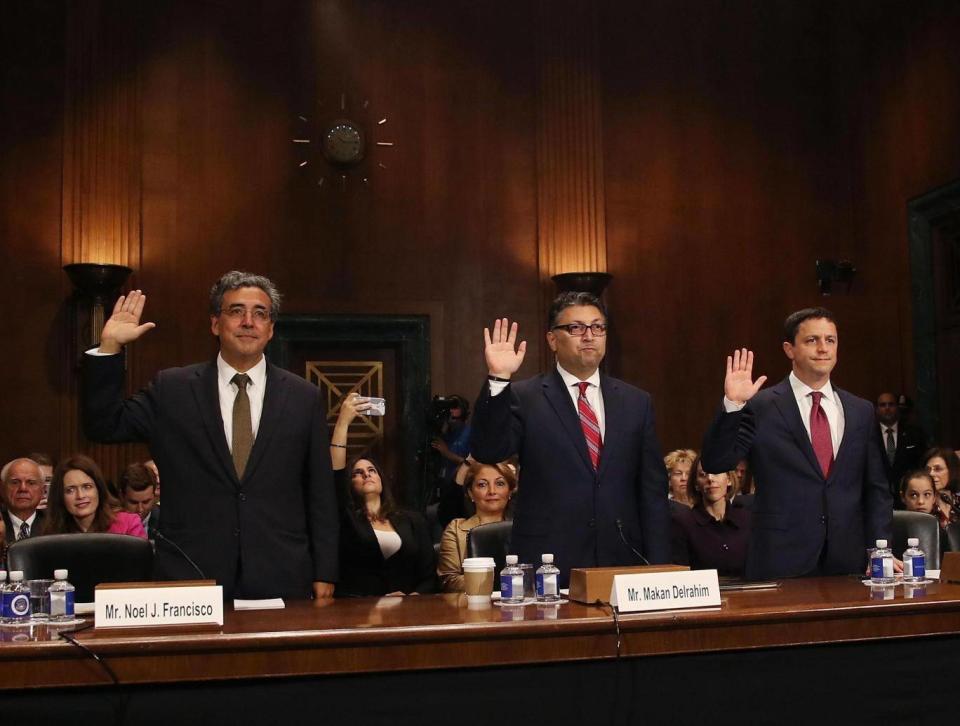 Justice Department nominees, (L-R), Noel Francisco to be Solicitor General, Makan Delrahim to be an assistant attorney general in the Antitrust Division, and Steven Engel to be an assistant attorney general in the Office of Legal Counsel, raise their right hands as they are sworn in during their Senate Judiciary Committee confirmation hearing on Capitol Hill, on 10 May 2017. (Getty)